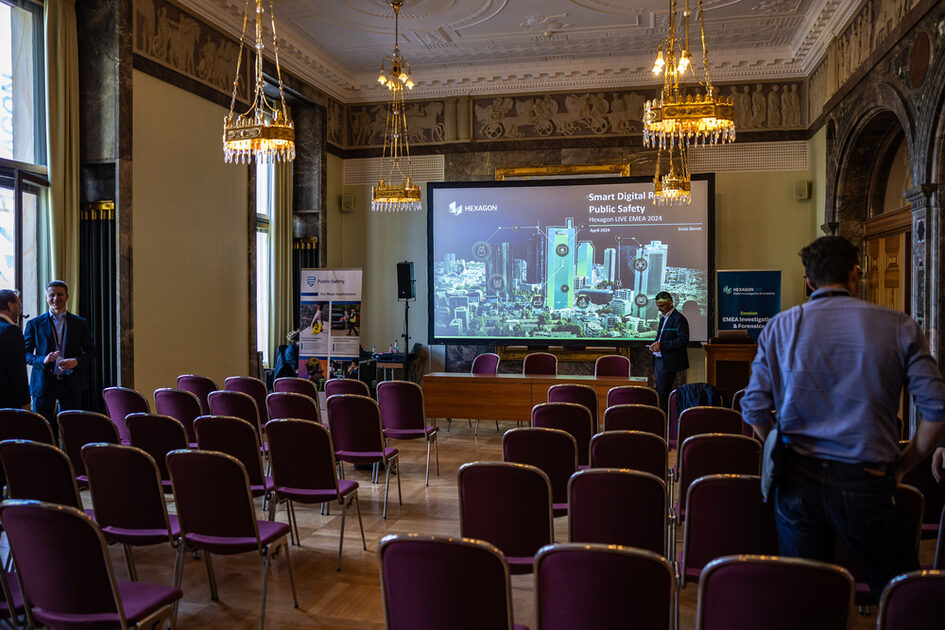 Row seating in front of a large screen