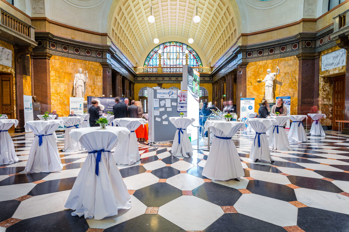 Reception in the foyer of the Kurhaus Wiesbaden - bar tables in the center and mobile advertising spaces in the center and on the sides