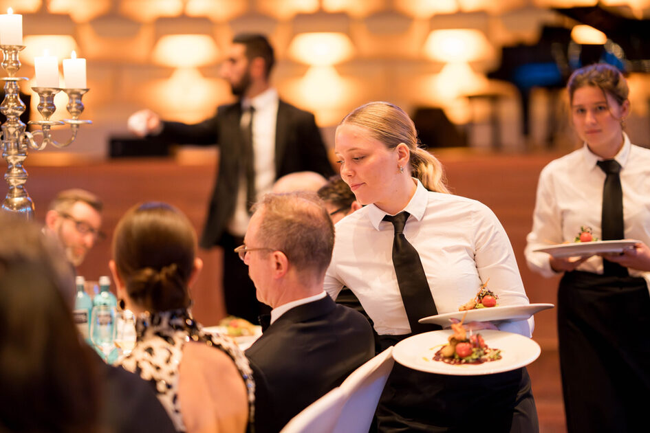 A waitress serves the food