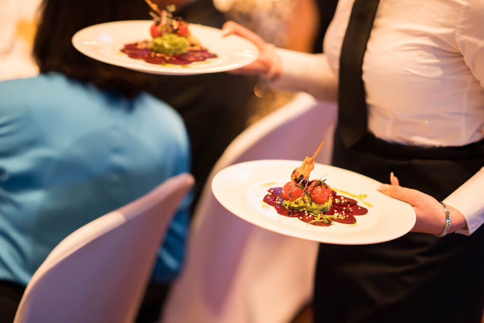A waitress serves the food