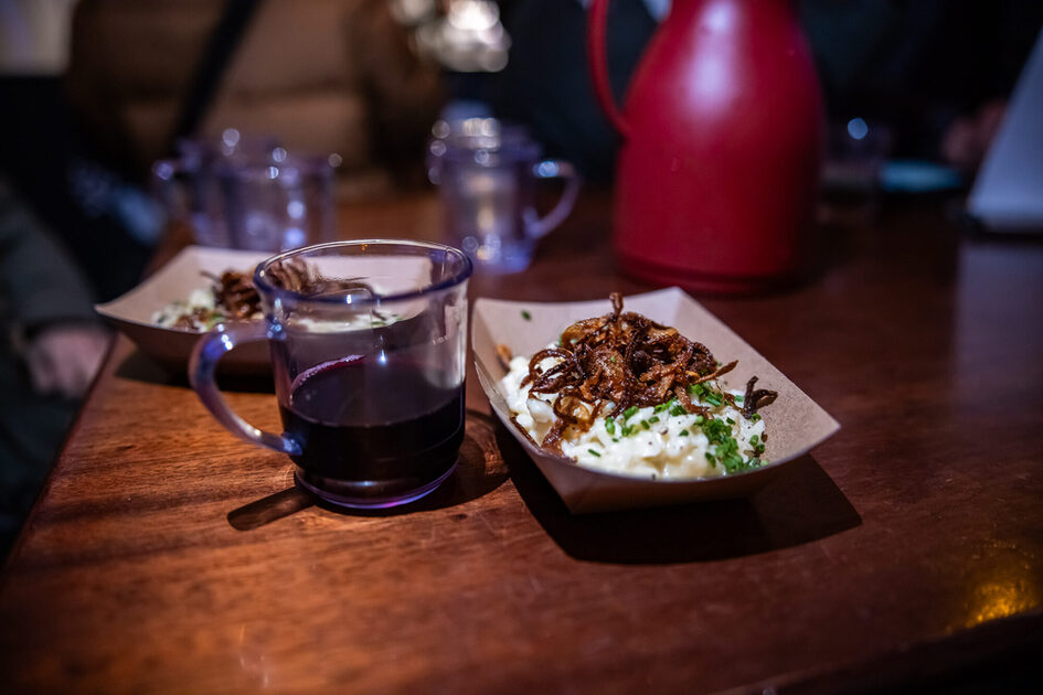Cheese spaetzle and cup of mulled wine