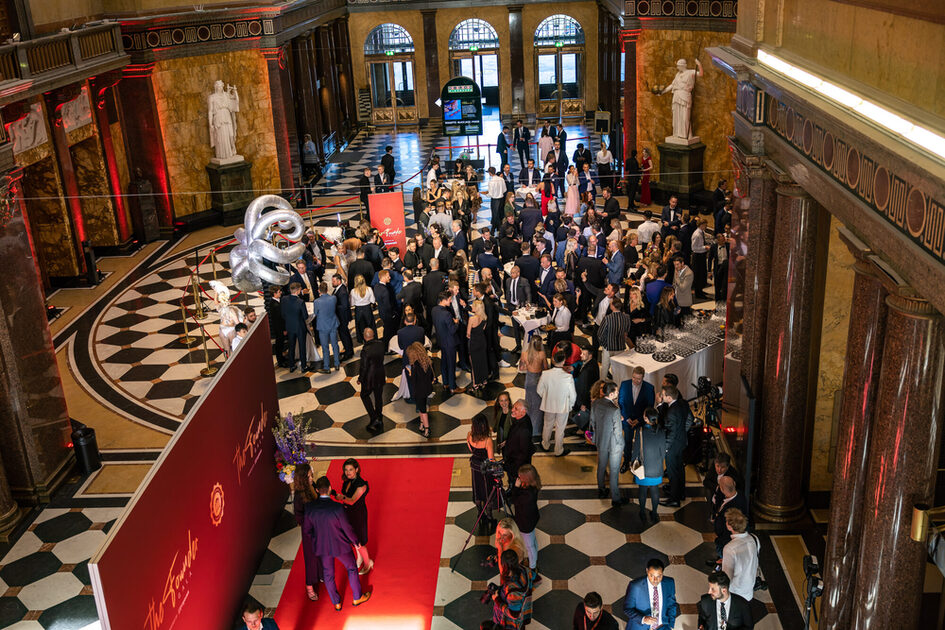 Champagne reception with the event guests in the foyer