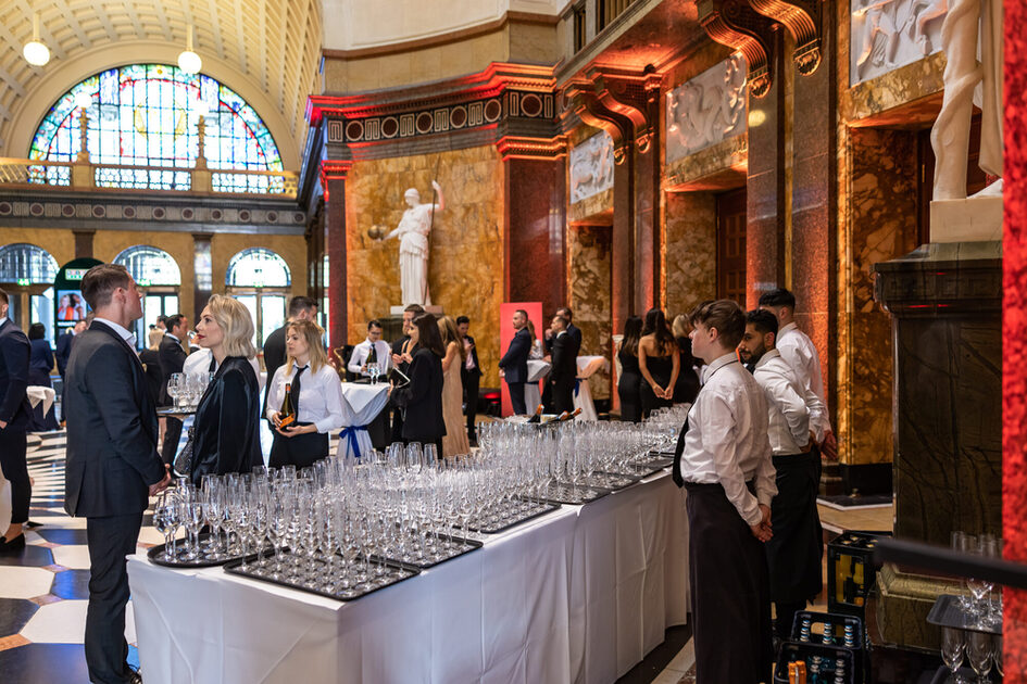 Guests in front of the table with the wine glasses